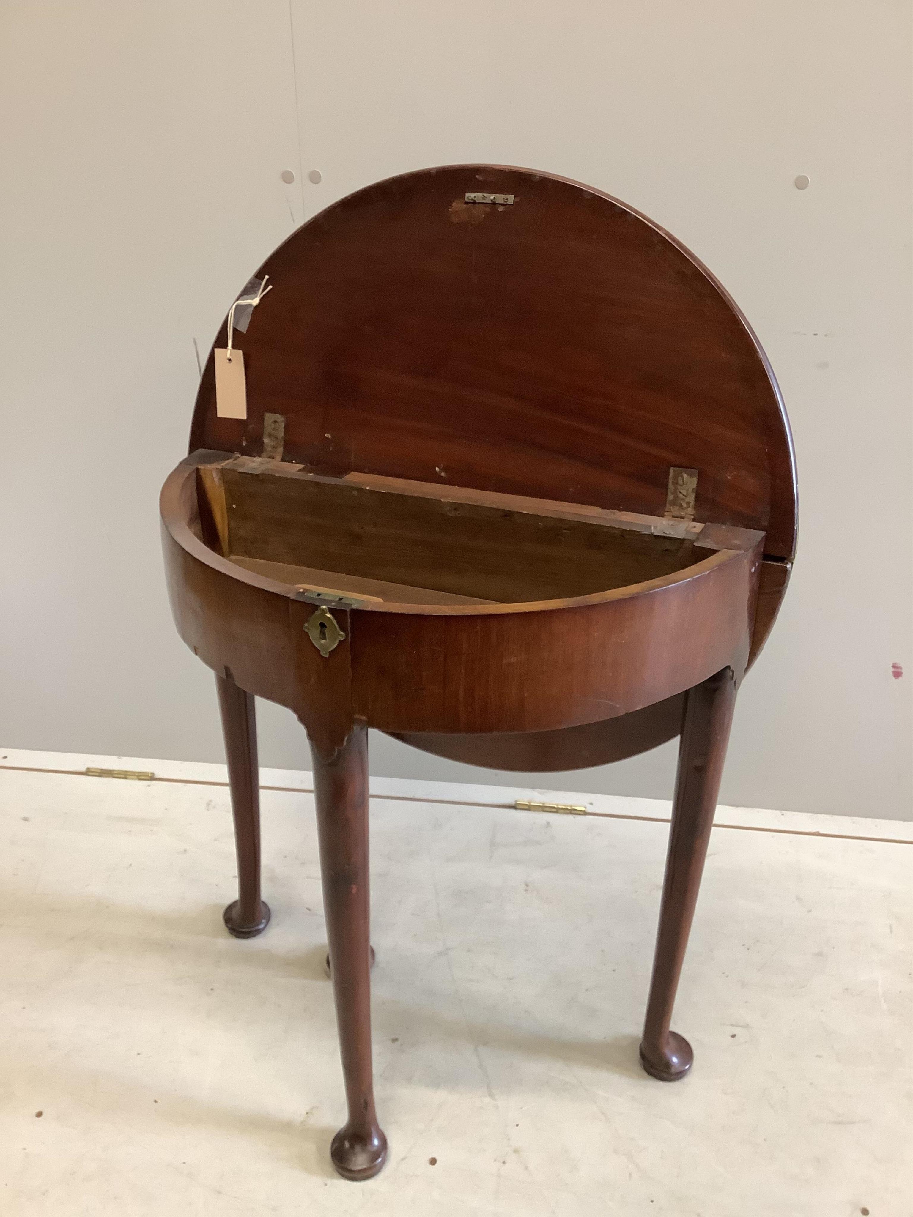 A small George II and later demi lune folding mahogany tea table, width 64cm, depth 32cm, height 70cm. Condition - fair